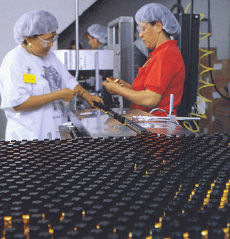 Women filing polish bottles